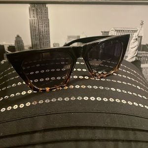 Cat-eye shape with flat-top style. 🕶️ Sunglasses